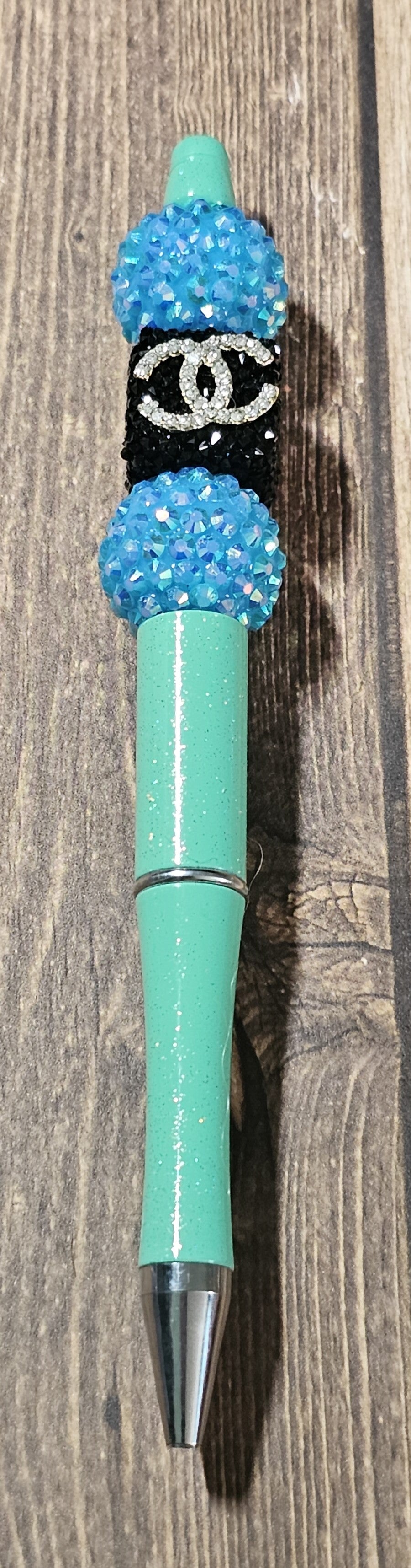 Teal, Blue, and Black C's Pen