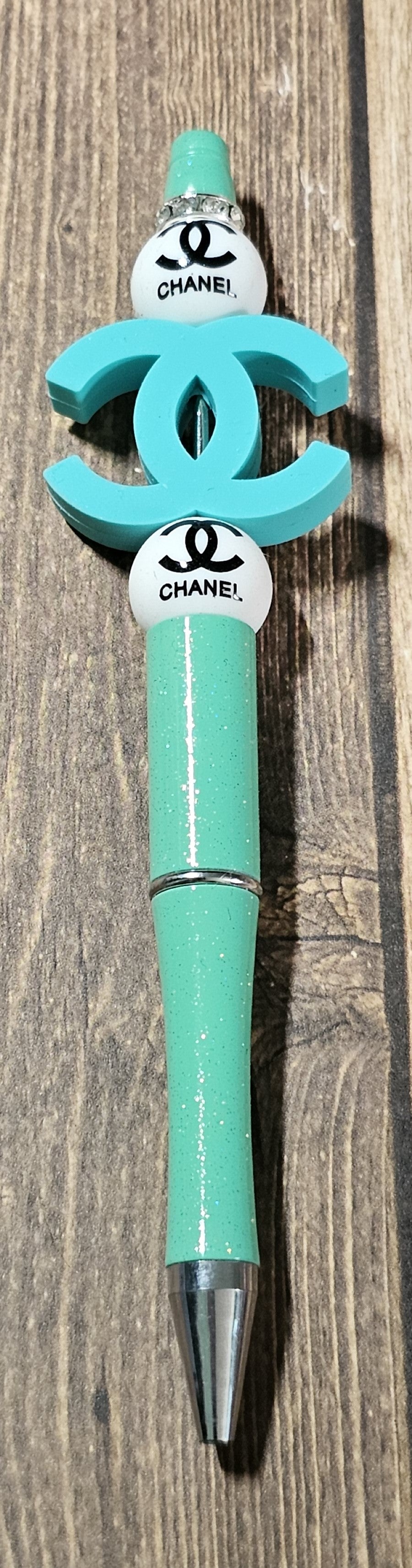 Teal and White C's Pen